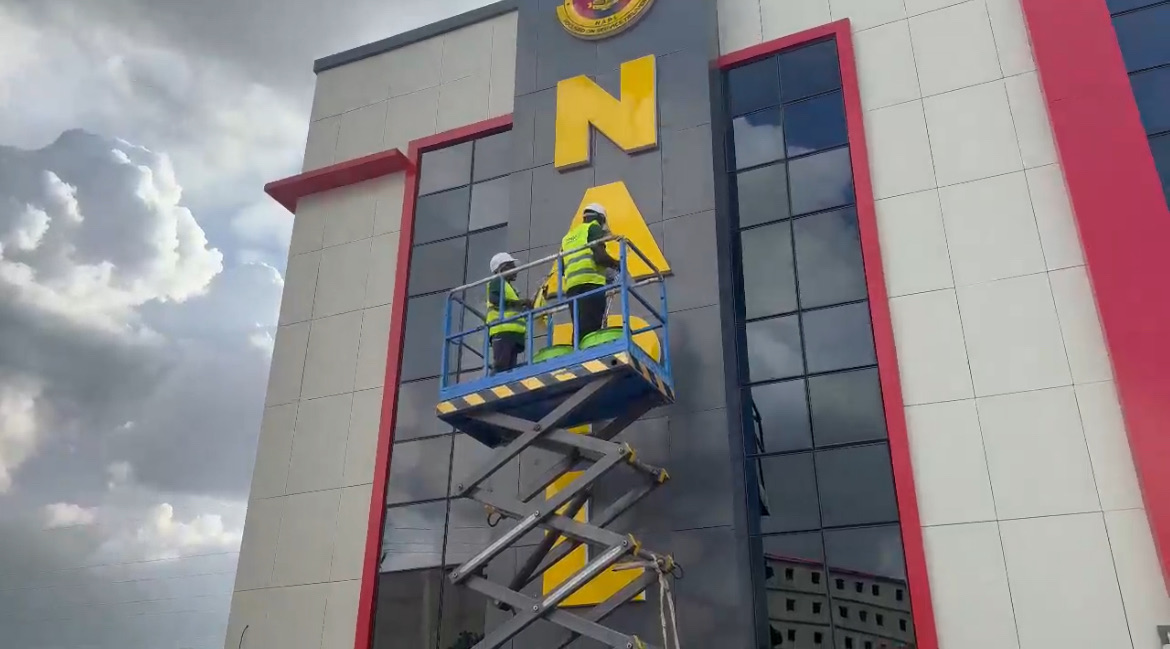 High-rise facade and signage installation