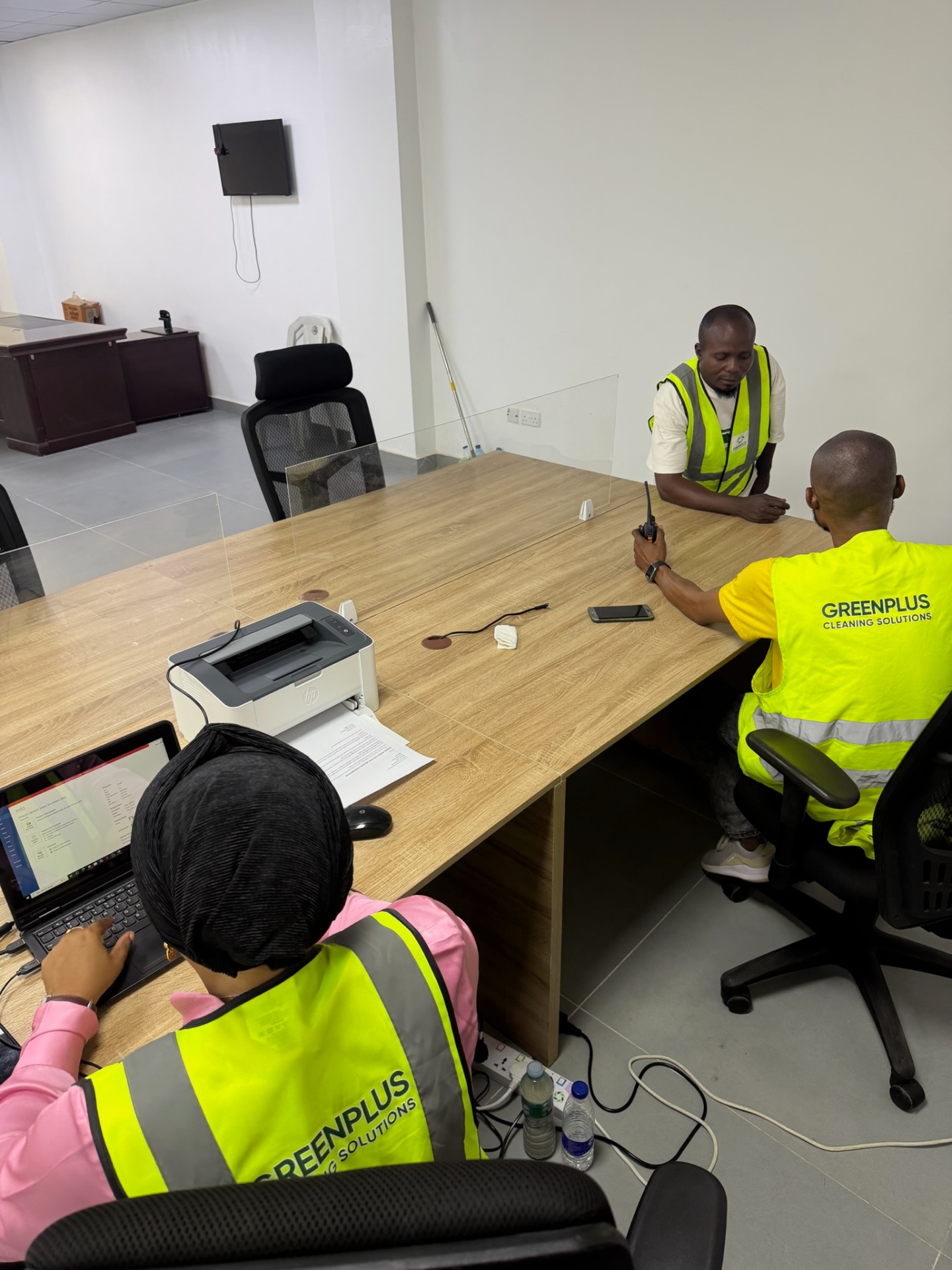 GreenPlus trained cleaning team with equipment